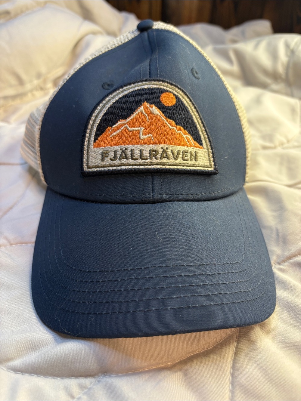 Fjallraven Navy and Orange Mountain Patch Trucker Hat